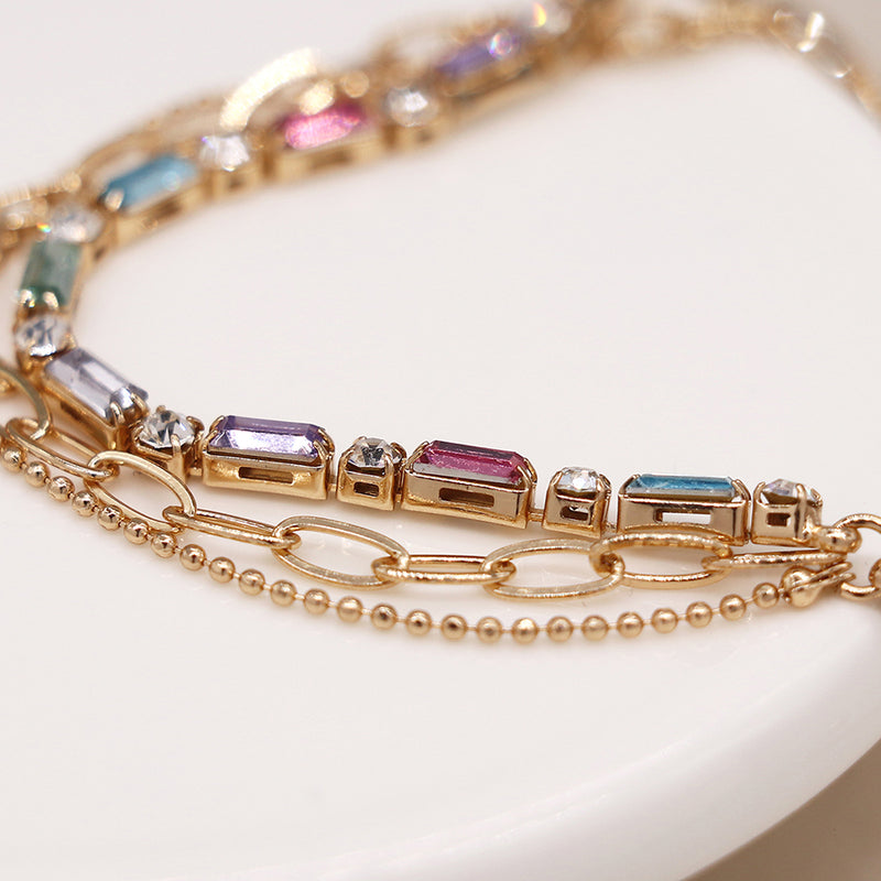 Golden multicoloured crystals and chains bracelet