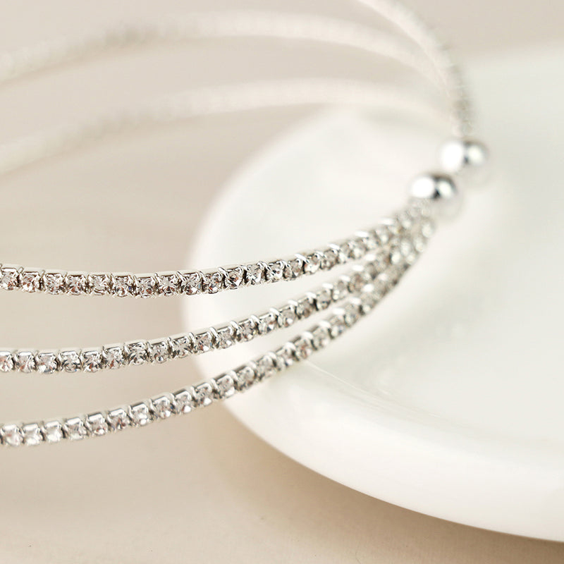Silver plated triple strand crystal bracelet