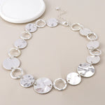 Silver plated worn discs and hoops necklace