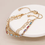 Golden multicoloured crystals and chains bracelet