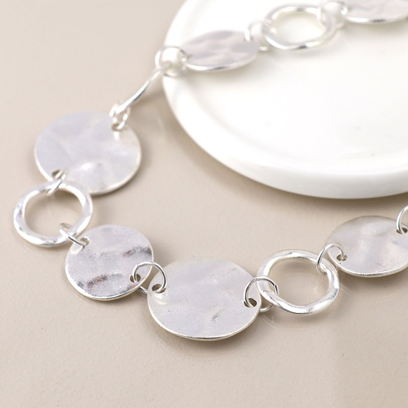 Silver plated worn discs and hoops necklace