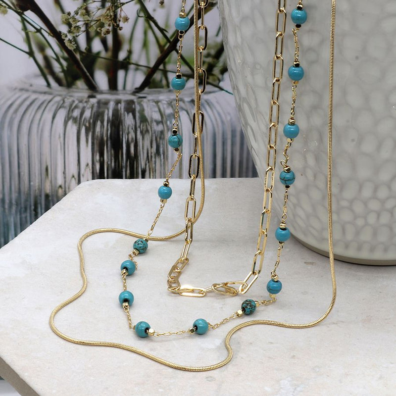 Triple layer golden mixed chain and turquoise bead necklace