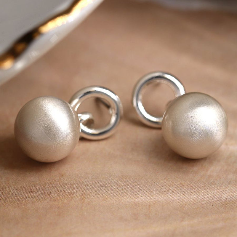 Silver plated shiny hoop and brushed sphere drop earrings