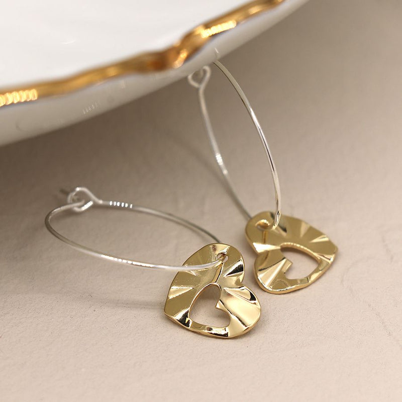 Silver plated hoop and golden heart cut-out earrings