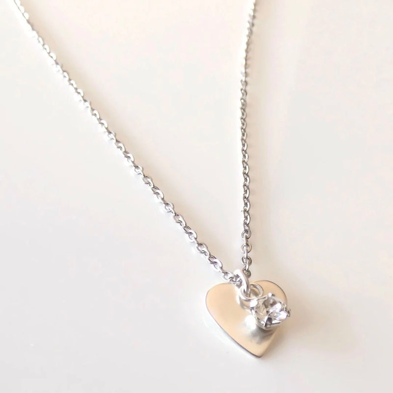 Ultra fine chain necklace featuring flat heart and crystal
