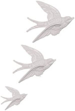 Set of three flying swallows